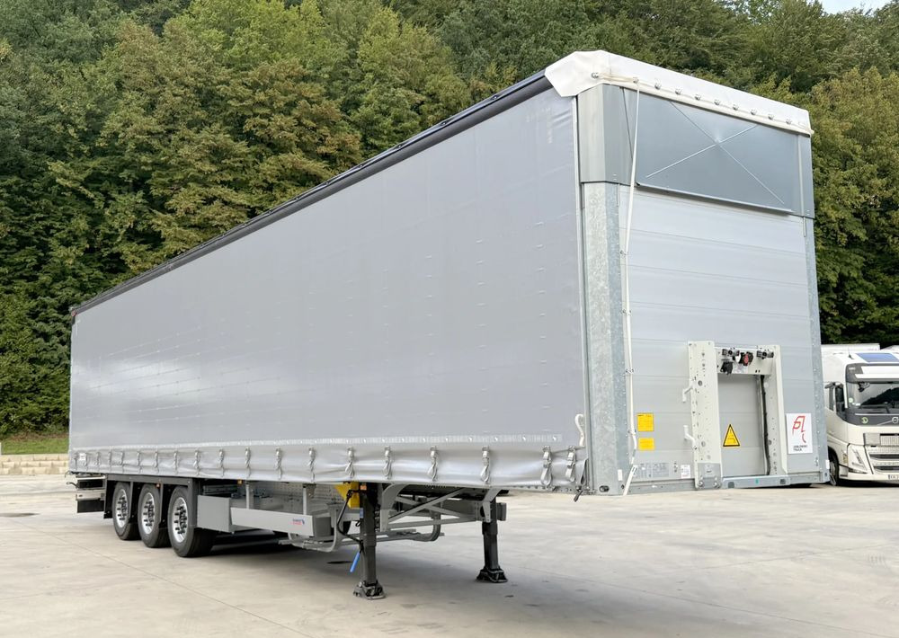 Schmitz Cargobull MEGA VARIOS - Gjysmë rimorkio me tendë: foto 5 Schmitz Cargobull MEGA VARIOS - Gjysmë rimorkio me tendë: foto 5