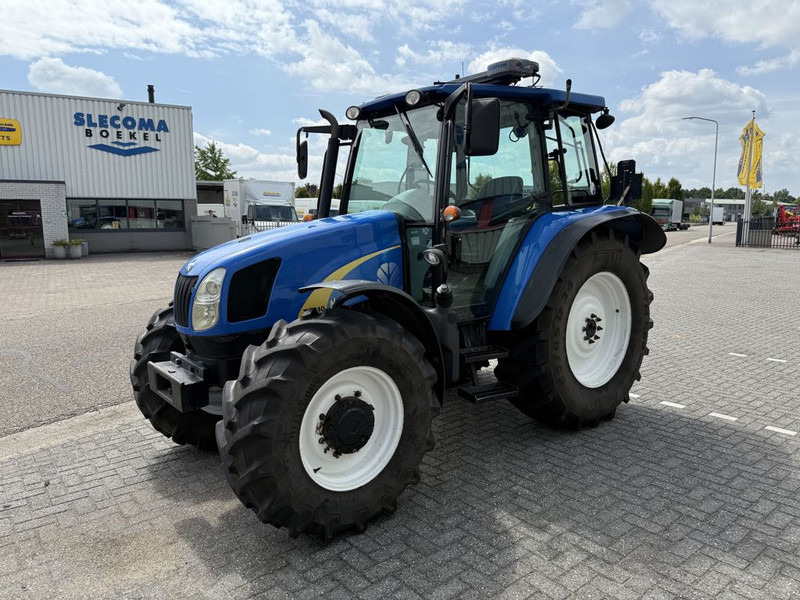 New Holland T5040 CAB + GPS - Traktor: foto 1 New Holland T5040 CAB + GPS - Traktor: foto 1