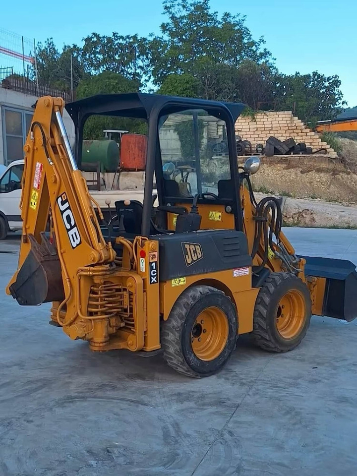 JCB 1CX - Fadromë me shkarkim nga prapa: foto 5 JCB 1CX - Fadromë me shkarkim nga prapa: foto 5