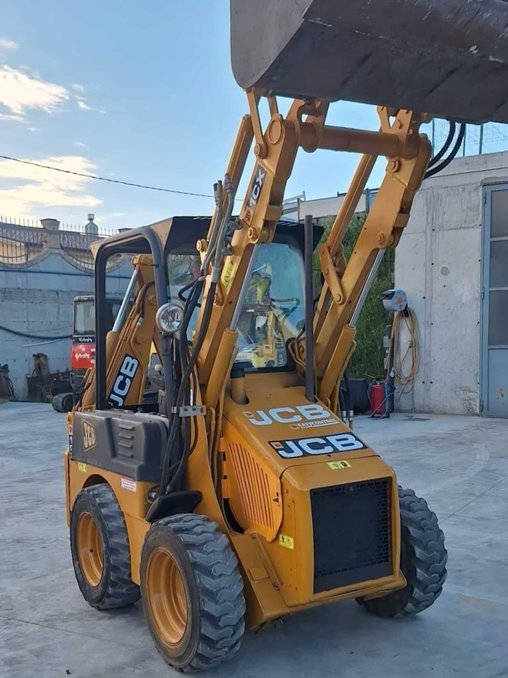 JCB 1CX - Fadromë me shkarkim nga prapa: foto 3 JCB 1CX - Fadromë me shkarkim nga prapa: foto 3