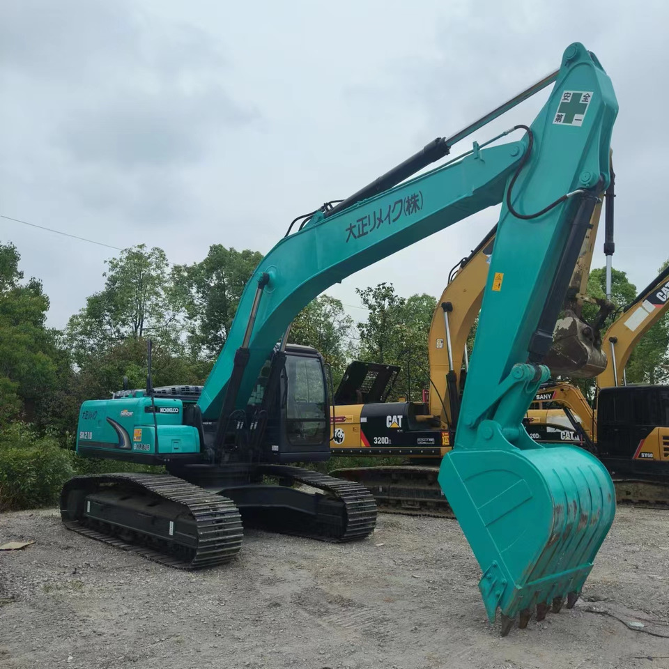 KOBELCO SK210 - Ekskavator me zinxhirë: foto 4 KOBELCO SK210 - Ekskavator me zinxhirë: foto 4