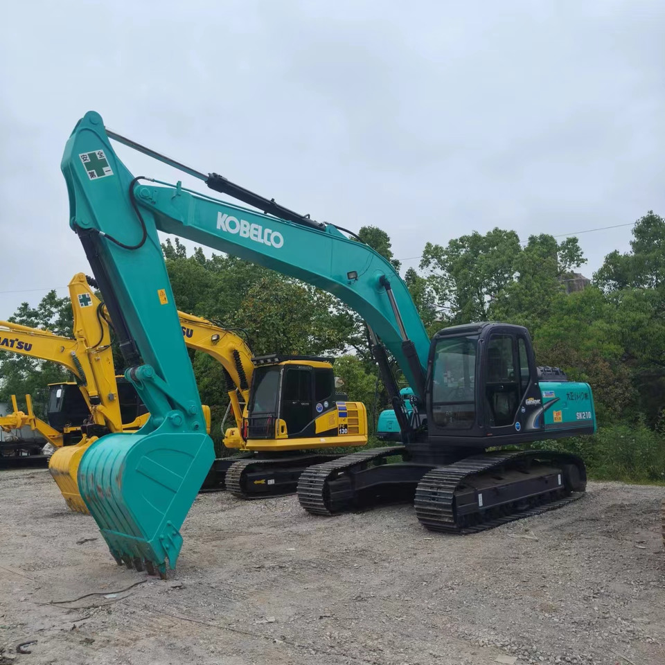 KOBELCO SK210 - Ekskavator me zinxhirë: foto 1 KOBELCO SK210 - Ekskavator me zinxhirë: foto 1