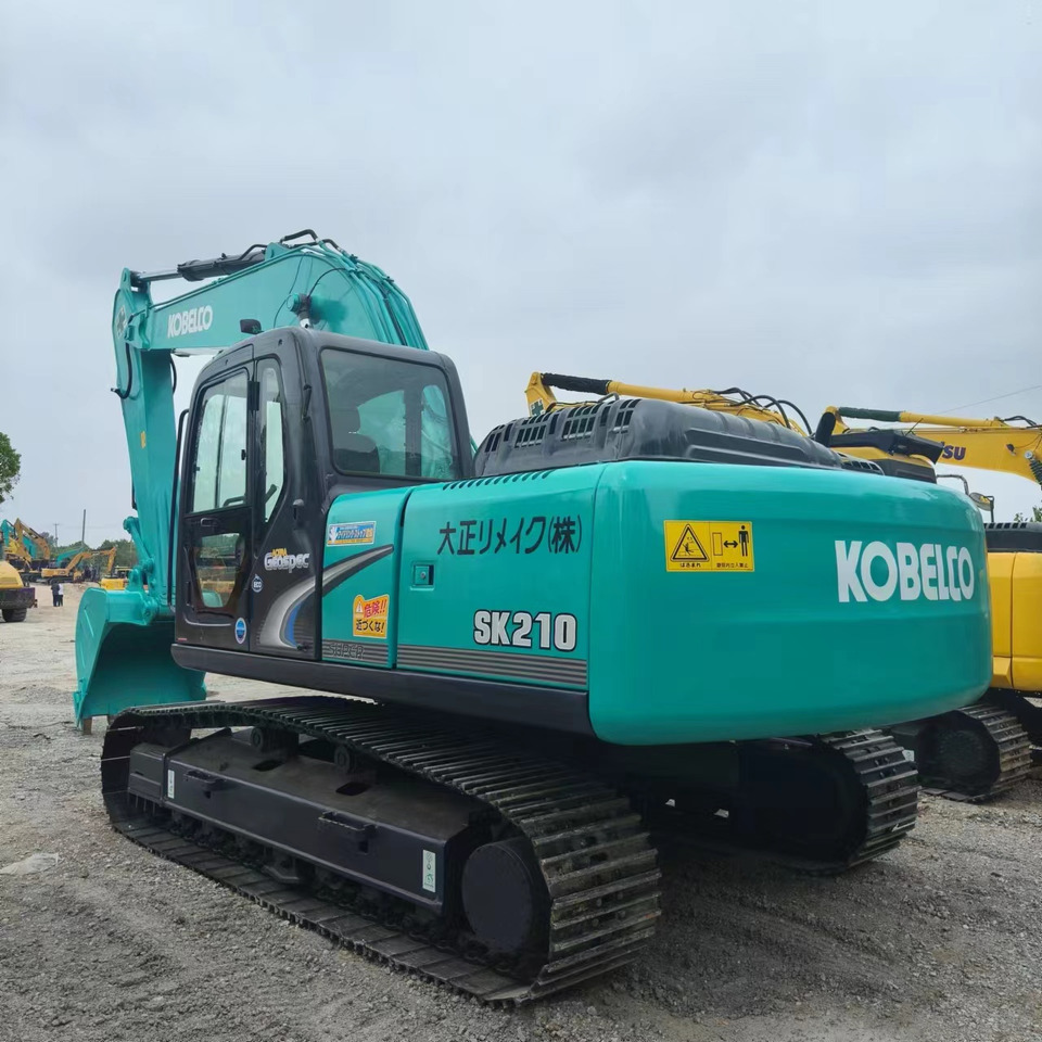 KOBELCO SK210 - Ekskavator me zinxhirë: foto 2 KOBELCO SK210 - Ekskavator me zinxhirë: foto 2