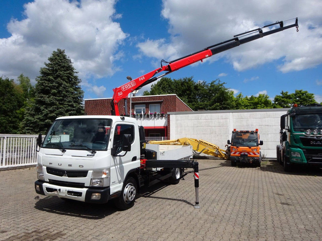FUSO Canter 7C15 mit FASSI F65A Kran - Kamion me vinç, Kamion me karroceri të hapur: foto 5 FUSO Canter 7C15 mit FASSI F65A Kran - Kamion me vinç, Kamion me karroceri të hapur: foto 5
