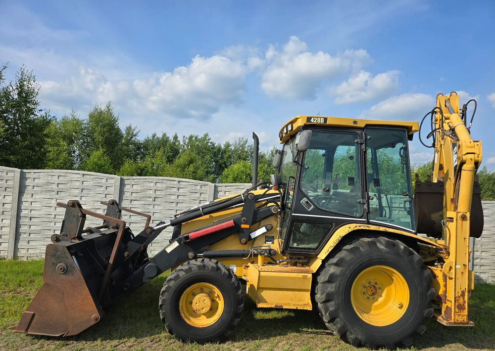 Caterpillar - Fadromë me shkarkim nga prapa: foto 2 Caterpillar - Fadromë me shkarkim nga prapa: foto 2