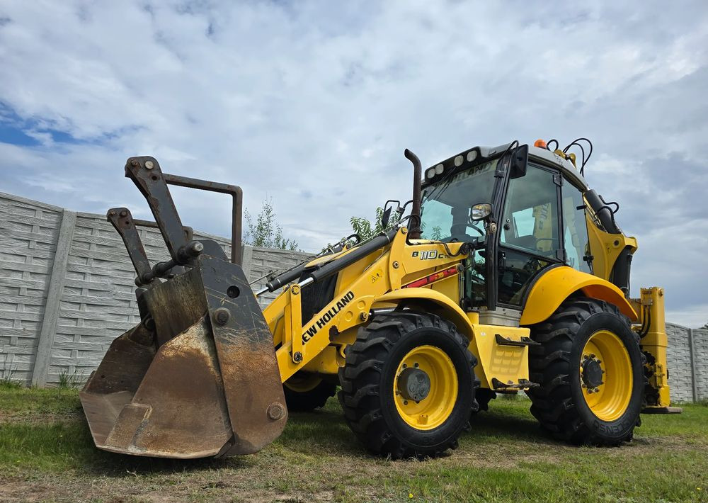New Holland - Fadromë me shkarkim nga prapa: foto 1 New Holland - Fadromë me shkarkim nga prapa: foto 1