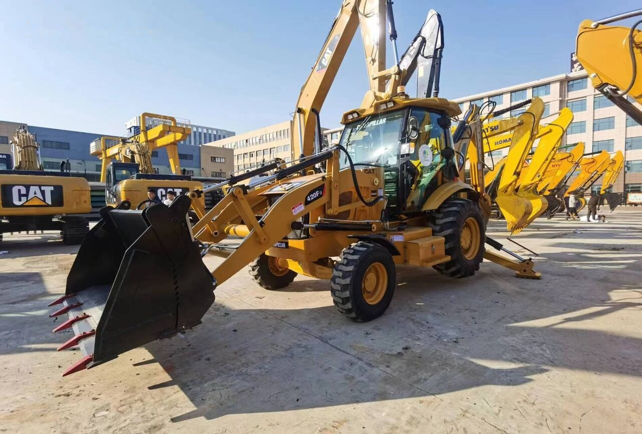 Fadromë me shkarkim nga prapa Caterpillar 420F: foto 11