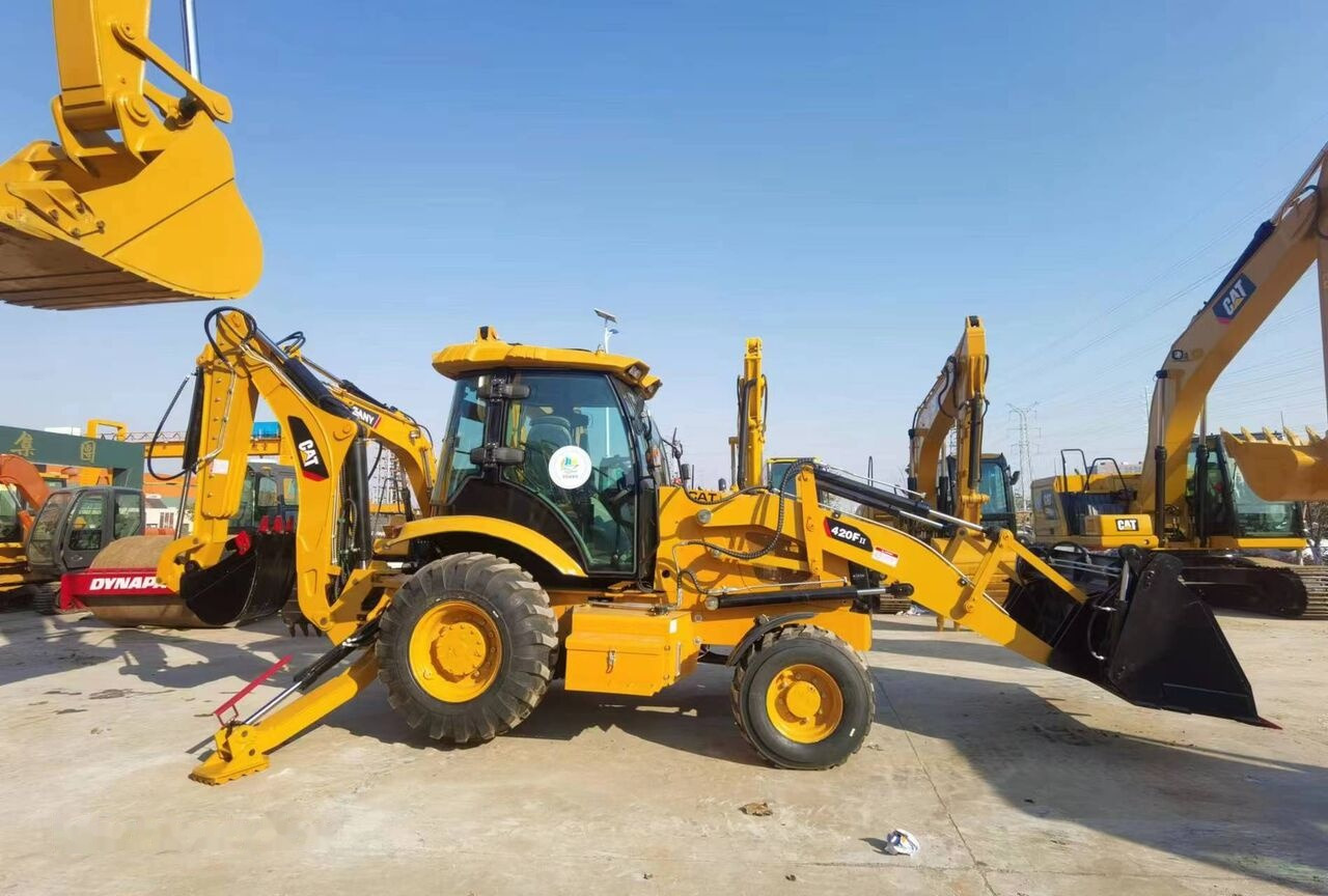 Fadromë me shkarkim nga prapa Caterpillar 420F: foto 12