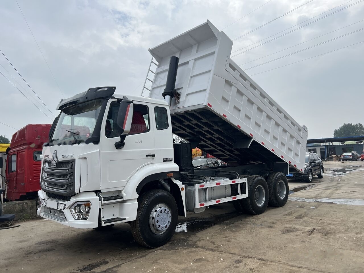 Sinotruk Howo - Kamion vetëshkarkues: foto 3 Sinotruk Howo - Kamion vetëshkarkues: foto 3