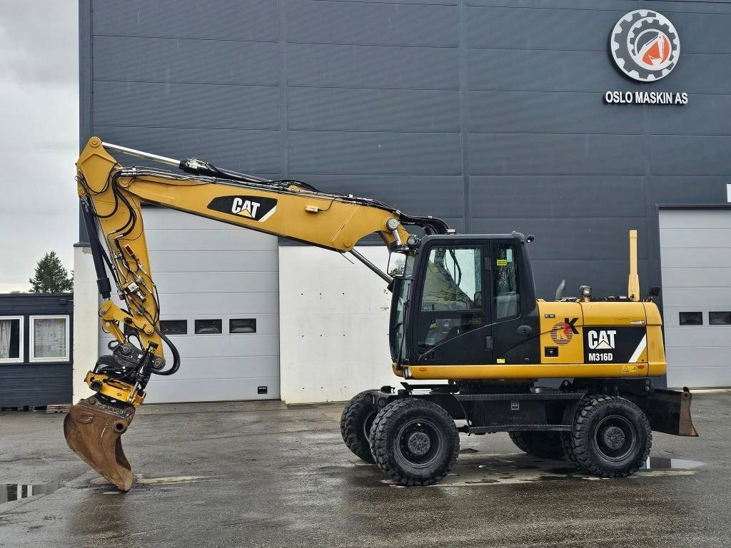 CAT M 316 D - Ekskavator me goma: foto 2 CAT M 316 D - Ekskavator me goma: foto 2