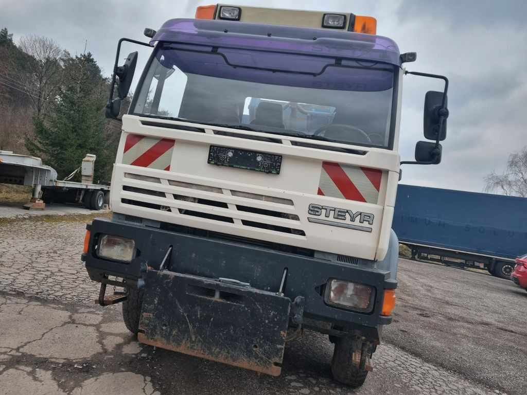 MAN (STEYR) 18.284 4x4 abrollkipper - Kamion vetëngarkues: foto 2 MAN (STEYR) 18.284 4x4 abrollkipper - Kamion vetëngarkues: foto 2