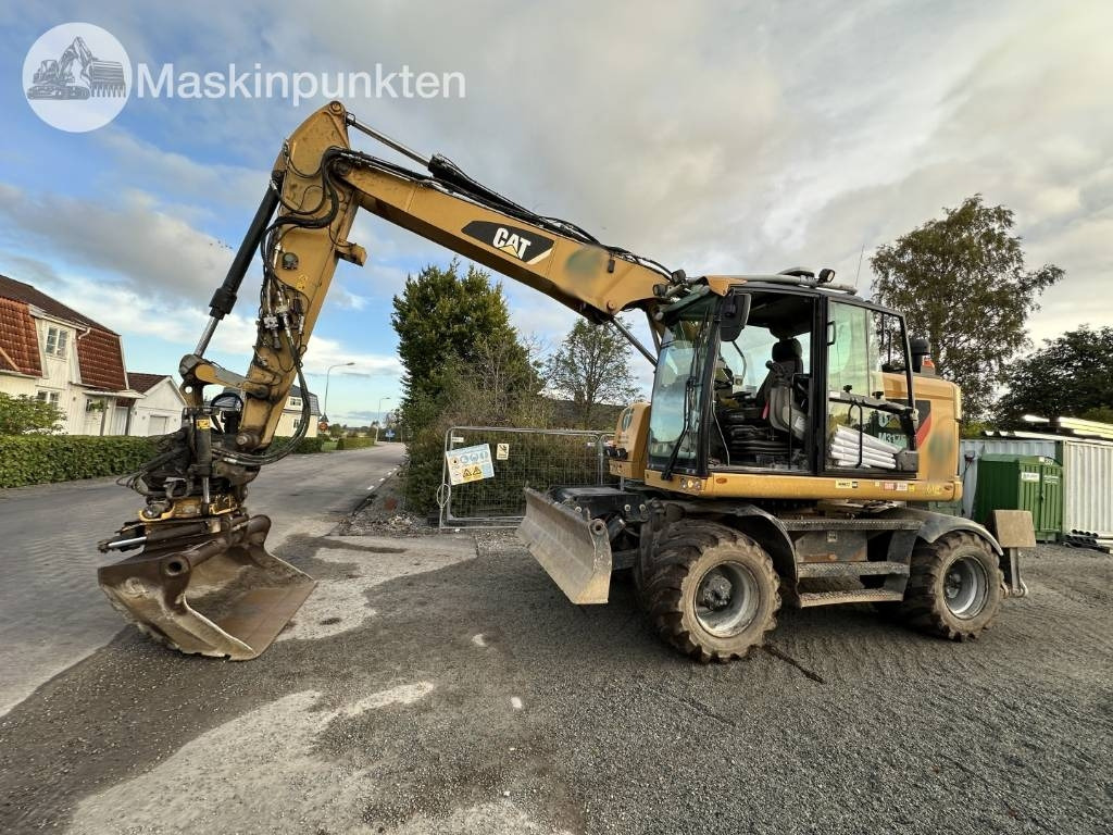 CAT M 317 - Ekskavator me goma: foto 1 CAT M 317 - Ekskavator me goma: foto 1