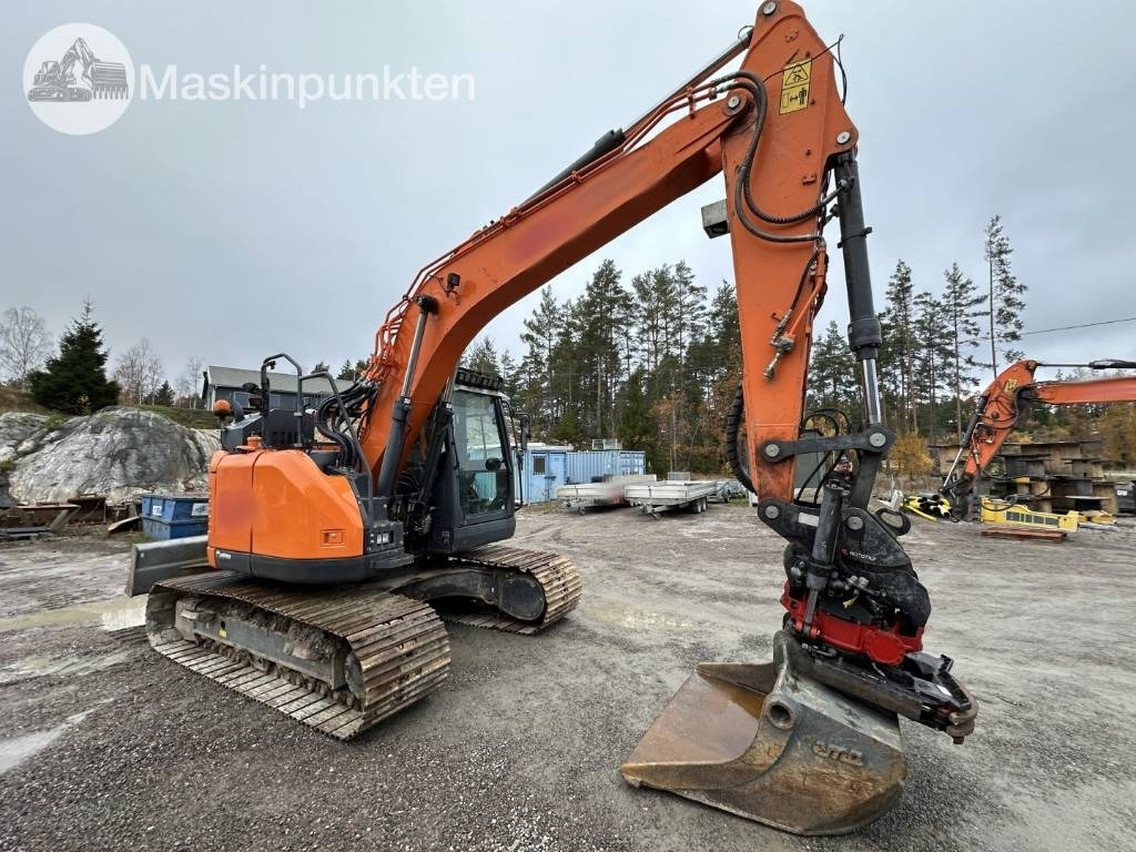 Doosan DX 140 LCR-5 - Ekskavator me zinxhirë: foto 4 Doosan DX 140 LCR-5 - Ekskavator me zinxhirë: foto 4