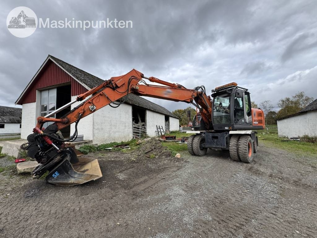 Hitachi ZX 140 W-3 - Ekskavator me goma: foto 1 Hitachi ZX 140 W-3 - Ekskavator me goma: foto 1