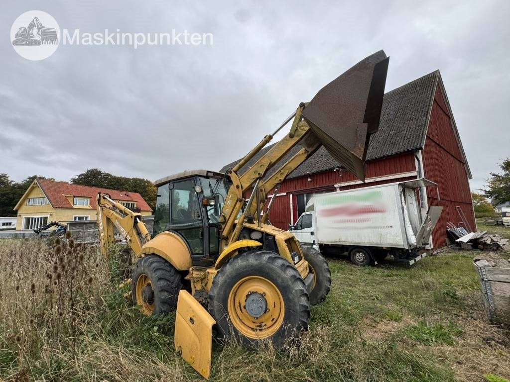 New Holland LB 115 - Fadromë me shkarkim nga prapa: foto 4 New Holland LB 115 - Fadromë me shkarkim nga prapa: foto 4