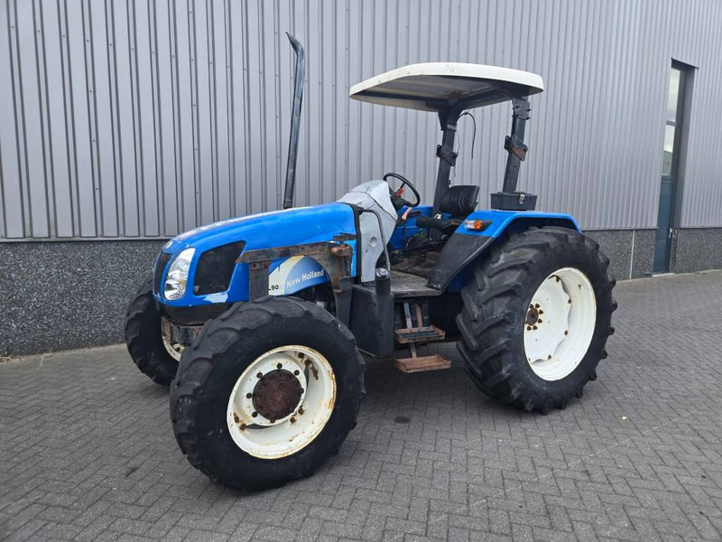 New Holland TL 90 A - Traktor: foto 1 New Holland TL 90 A - Traktor: foto 1