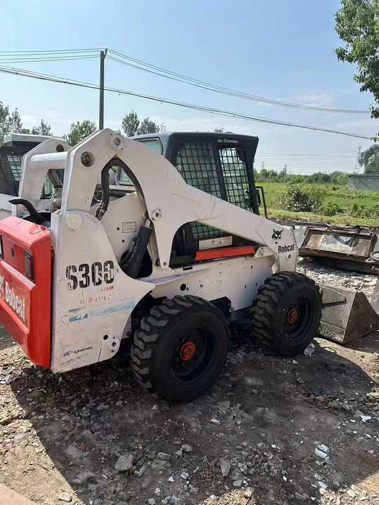 Used Bob Cat Bob Cat S300 Used Skid Steer Wheel Loader Multifunctional Track Loaders Bobcat - Mini fadrom: foto 3 Used Bob Cat Bob Cat S300 Used Skid Steer Wheel Loader Multifunctional Track Loaders Bobcat - Mini fadrom: foto 3