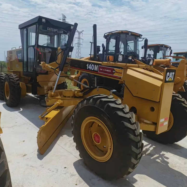 Used Japan Imported Caterpillar 140M Cat 140m Motor Grader with Good Quality and Low Price for Sale - Ekskavator: foto 1 Used Japan Imported Caterpillar 140M Cat 140m Motor Grader with Good Quality and Low Price for Sale - Ekskavator: foto 1