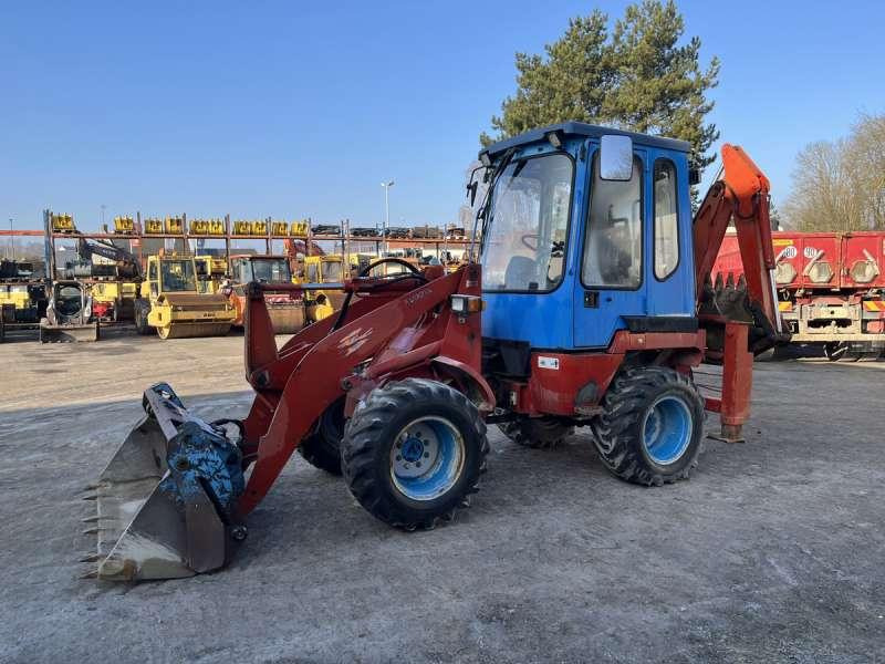 Kubota R520 - Fadromë me shkarkim nga prapa: foto 3 Kubota R520 - Fadromë me shkarkim nga prapa: foto 3