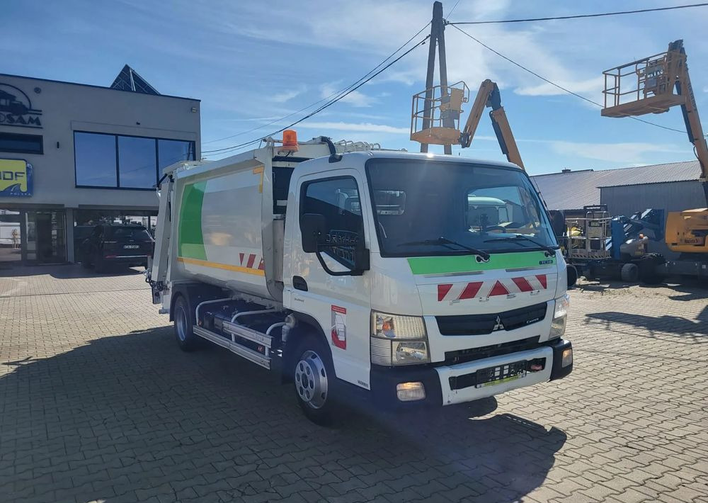 Mitsubishi Fuso Canter - Kamion mbeturinash: foto 2 Mitsubishi Fuso Canter - Kamion mbeturinash: foto 2