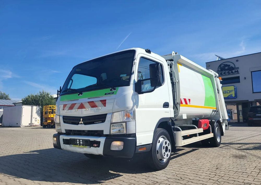 Mitsubishi Fuso Canter - Kamion mbeturinash: foto 1 Mitsubishi Fuso Canter - Kamion mbeturinash: foto 1