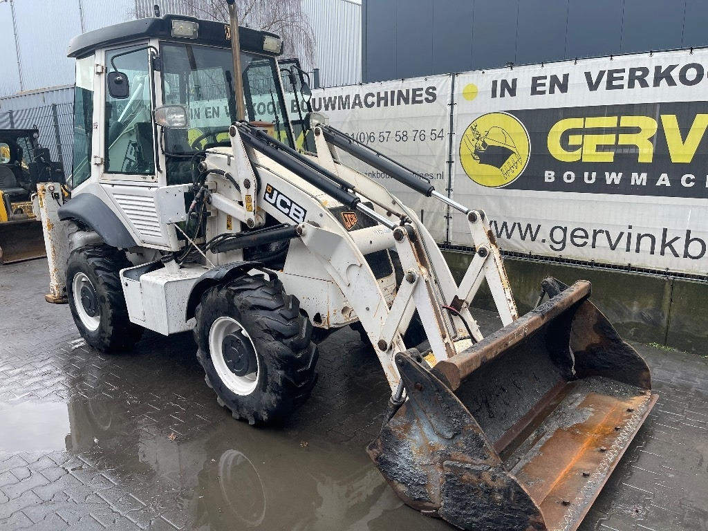 JCB 2 CX - Fadromë me shkarkim nga prapa: foto 3 JCB 2 CX - Fadromë me shkarkim nga prapa: foto 3