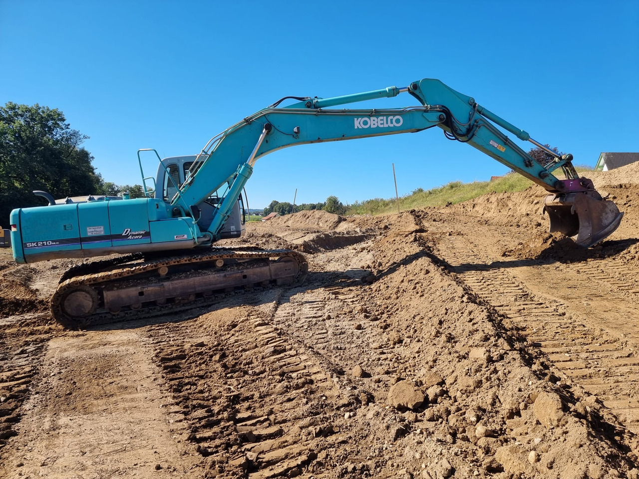 KOBELCO SK 210 NLC-6E - Ekskavator me zinxhirë: foto 2 KOBELCO SK 210 NLC-6E - Ekskavator me zinxhirë: foto 2