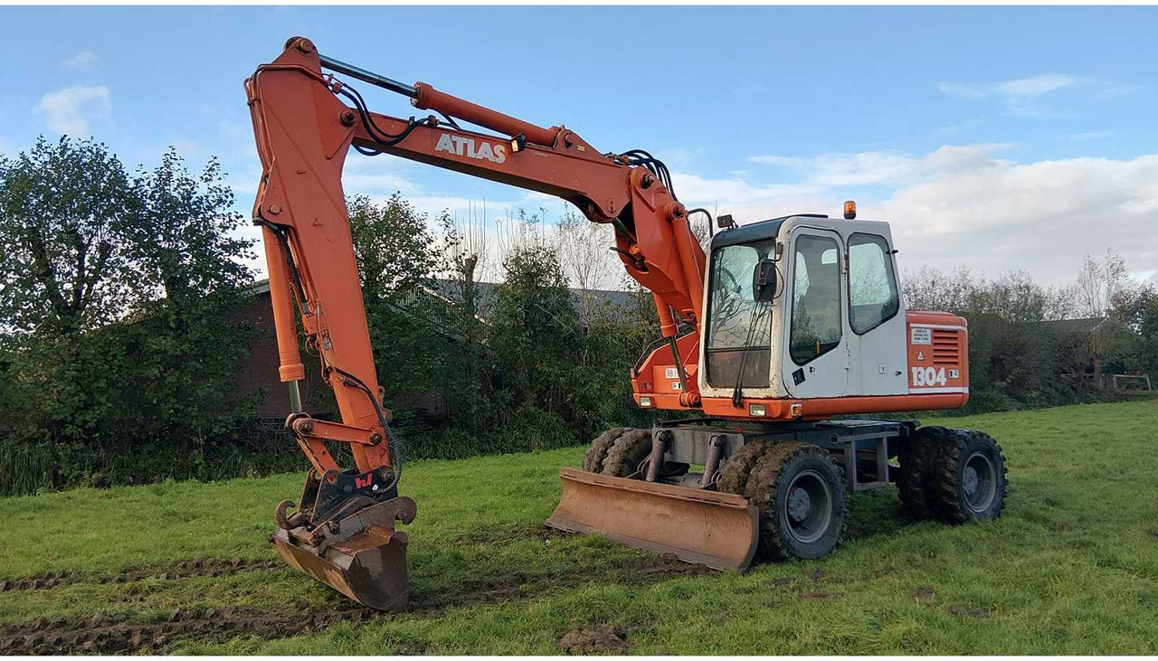1994 ATLAS 1304 WHEELED EXCAVATOR - Ekskavator me goma: foto 1 1994 ATLAS 1304 WHEELED EXCAVATOR - Ekskavator me goma: foto 1