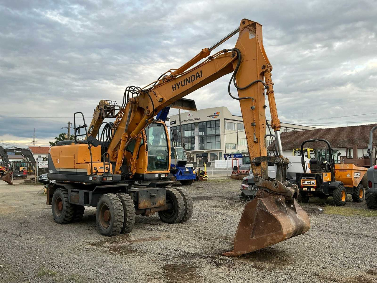 HYUNDAI ROBEX 140W-9 - Ekskavator me goma: foto 1 HYUNDAI ROBEX 140W-9 - Ekskavator me goma: foto 1