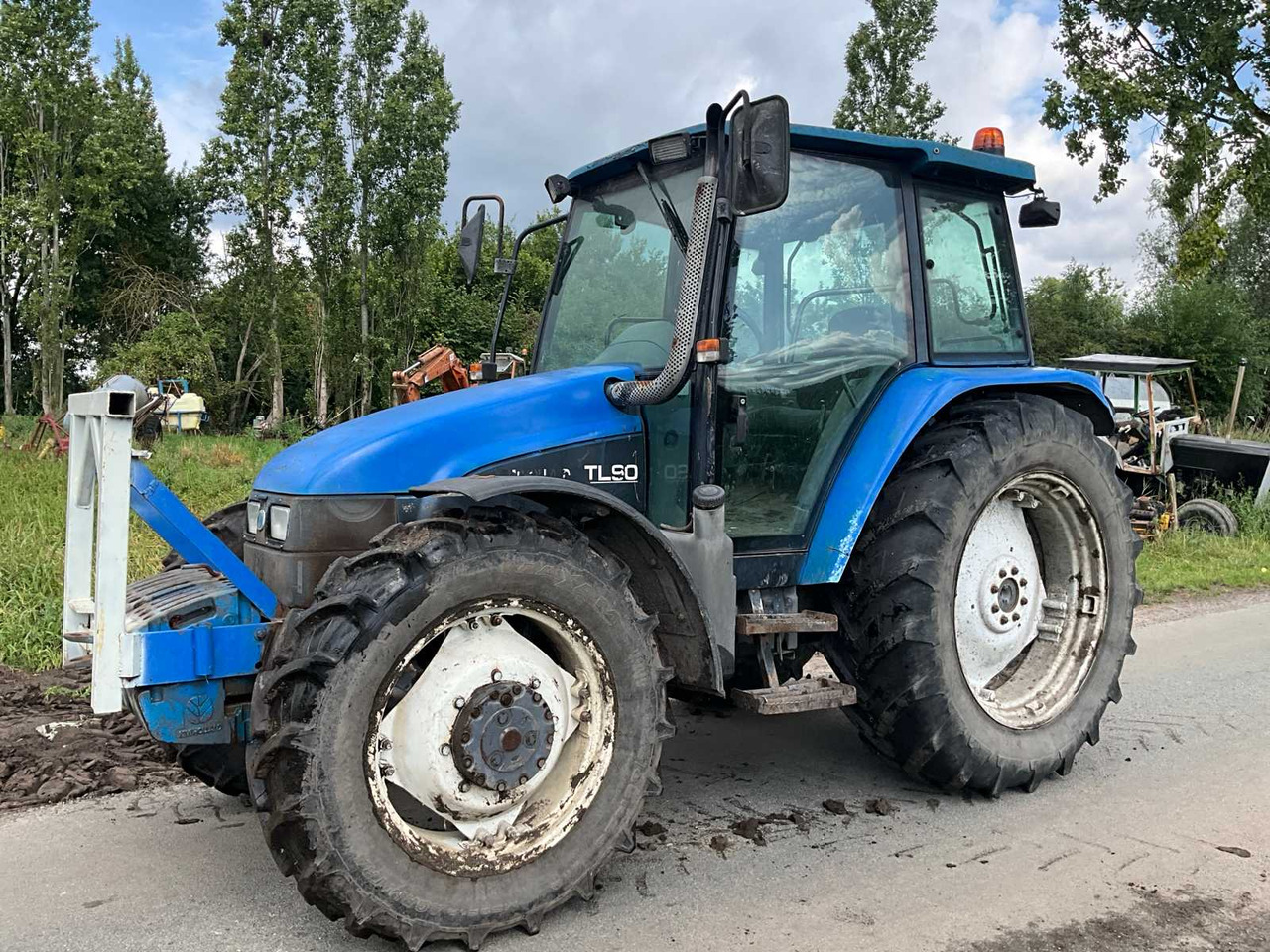 New Holland TL90 - Traktor: foto 2 New Holland TL90 - Traktor: foto 2