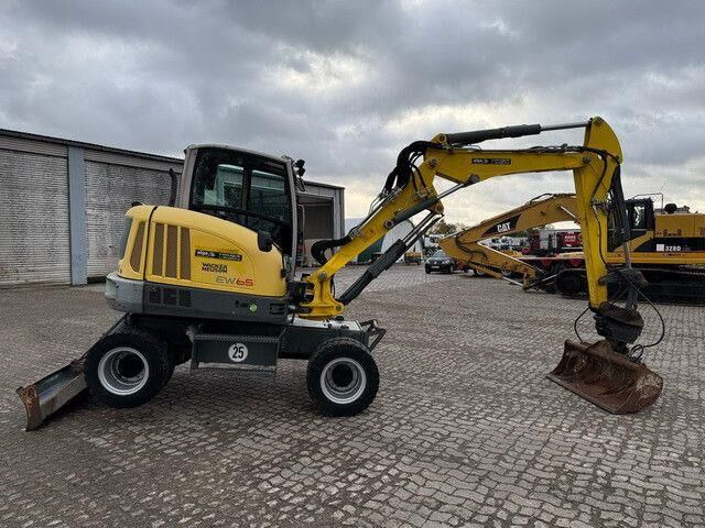 Neuson EW65, Verstellausleger, Hydr. S.W.S.,Div. Löffel - Ekskavator me goma: foto 5 Neuson EW65, Verstellausleger, Hydr. S.W.S.,Div. Löffel - Ekskavator me goma: foto 5