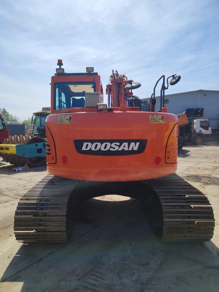 DOOSAN DX140LCR-3 - Ekskavator me zinxhirë: foto 5 DOOSAN DX140LCR-3 - Ekskavator me zinxhirë: foto 5