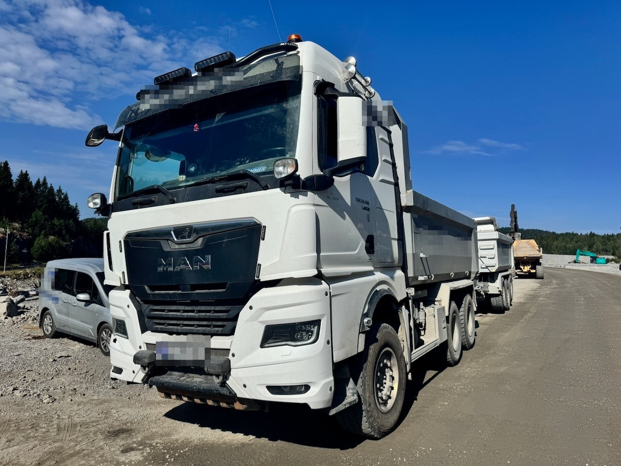 MAN TGX 33.580 - Kamion vetëshkarkues: foto 2 MAN TGX 33.580 - Kamion vetëshkarkues: foto 2