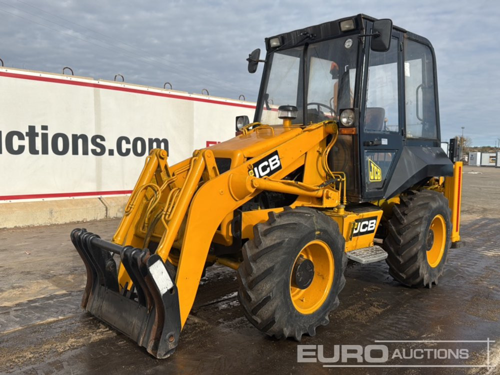 JCB 2CX - Fadromë me shkarkim nga prapa: foto 1 JCB 2CX - Fadromë me shkarkim nga prapa: foto 1