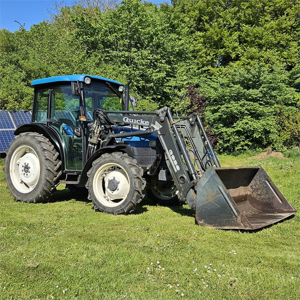 New Holland TN55D - Traktor: foto 1 New Holland TN55D - Traktor: foto 1