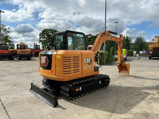 Caterpillar 305.5E2 - Ekskavator me zinxhirë: foto 4 Caterpillar 305.5E2 - Ekskavator me zinxhirë: foto 4