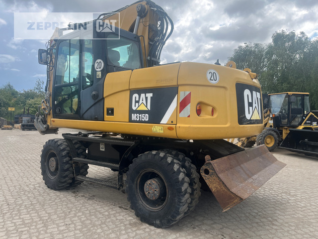 Cat M315D - Ekskavator me goma: foto 1 Cat M315D - Ekskavator me goma: foto 1
